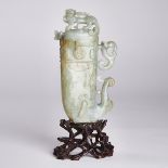 A Celadon and Russet Jade Archaistic Vessel (Gong) and Cover, 18th Century, 清 十八世纪 青玉带皮'螭龙'纹觥杯, jade