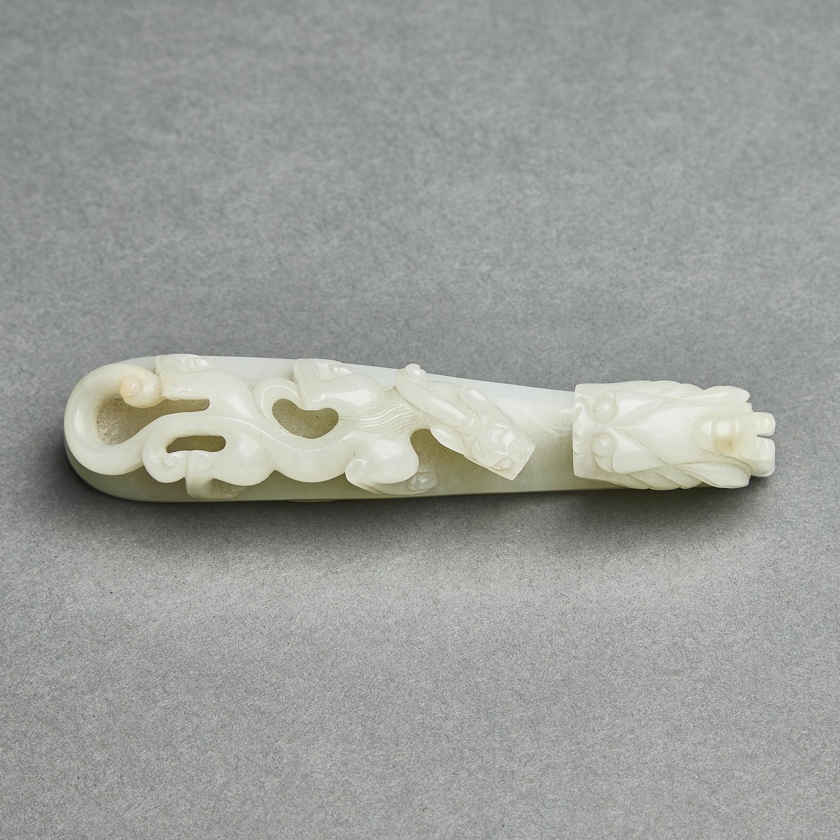 A Pale Celadon Jade 'Dragon' Belt Hook, Qing Dynasty, 清 青白玉雕'苍龙教子'带扣, length 5 in — 12.8 cm - Image 3 of 8