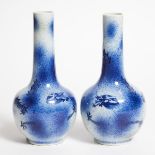 A Pair of Blue and White 'Dragon' Bottle Vases, 19th Century, 清 十九世纪 洒蓝云龙纹胆瓶一对, height 9.3 in — 23.5