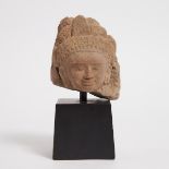 A Khmer Stone Head, 12th Century, including stand height 9.4 in — 24 cm