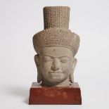 A Khmer-Style Stone Head of Buddha, with stand height 11.8 in — 30 cm