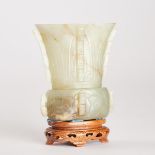 A Small Pale Celadon Jade Archaistic Zun-Form Vase, 19th Century, 清 十九世纪 青白玉雕兽面出戟尊, height 3.6 in —