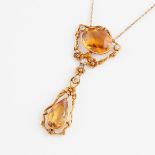 14k Yellow Gold Necklace, bezel set with an oval cut citrine (13.5 x 10.0 x 5.7mm), a pear cut citri