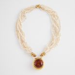 Italian 18k Yellow Gold And Multi-Strand Freshwater Pearl Necklace, the pendant bezel set with a rou