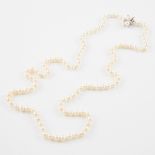 Single-Strand Cultured Pearl Necklace, (7.0mm) completed with a 14k white gold clasp set with 8 smal