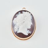 Oval Carved Hardstone Cameo, depicting the profile of a classical maiden, in a 14k yellow gold brooc