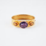 18k Yellow Gold Hinged Bangle, set with an oval cut amethyst and two oval cut citrines