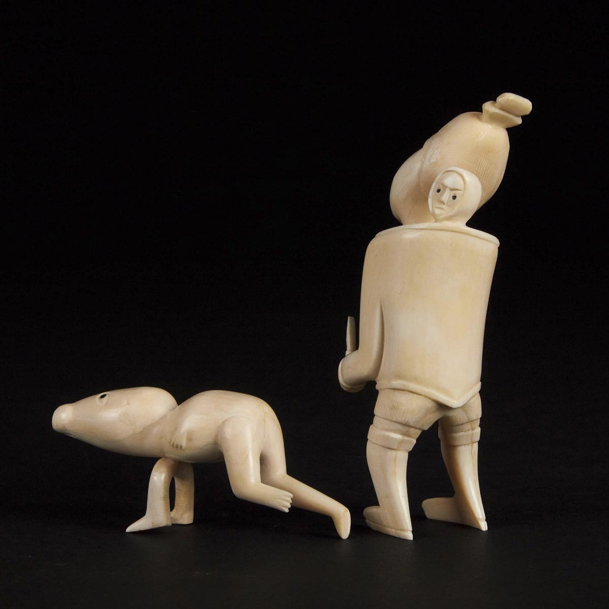 Unidentified Artist, PAIR OF TUPILAQS, ivory, largest 4.75 x 2 x 1.5 in — 12.1 x 5.1 x 3.8 cm - Image 3 of 3