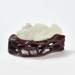 A White Jade 'Fish and Lotus' Group, Yuan Dynasty (1279-1368), 元 白玉带皮雕鲤鱼衔莲摆件, length 3.5 in — 9 cm