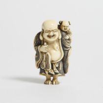 An Ivory Netsuke of Hotei With Karako, Signed Okakoto, Early 19th Century, height 2.3 in — 5.8 cm