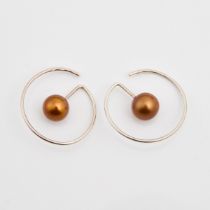 Pair Of Asa Hallqvist Swedish Sterling Silver Hoop Earrings, each set with a golden cultured pearl