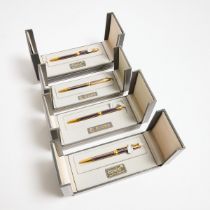 Four Élysée 'Parthenon' Ballpoint Pens, blue lacquer and gold-plated body; in the original boxes
