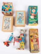6 Tinplate Toys. Ko-Ko Clockwork Sandwich Man, by TN Japan. Circus Clown, by K Japan. 2x