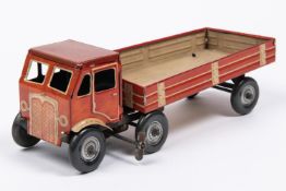 A Mettoy tinplate clockwork articulated lorry. The 4 wheeled tractor unit is in the style of AEC,