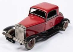 A Chad Valley tinplate clockwork American style 2 seater saloon. Finished in red with black/silver