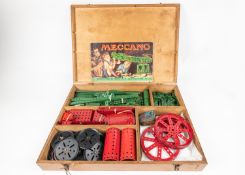 A Meccano branded wooden boxed set, major parts from Outfit No.6. Red and green components including