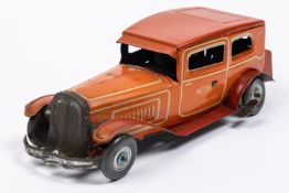 A 1930's style Mettoy tinplate clockwork 2 door saloon car. In orangey red with cream line