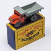 A Matchbox Series No. 6 Quarry Truck. In orange with grey tipping body (six ribs) and grey metal