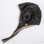 A WWII period leather flying helmet, with rubber ear cups and sheepskin lining. GC £150-200