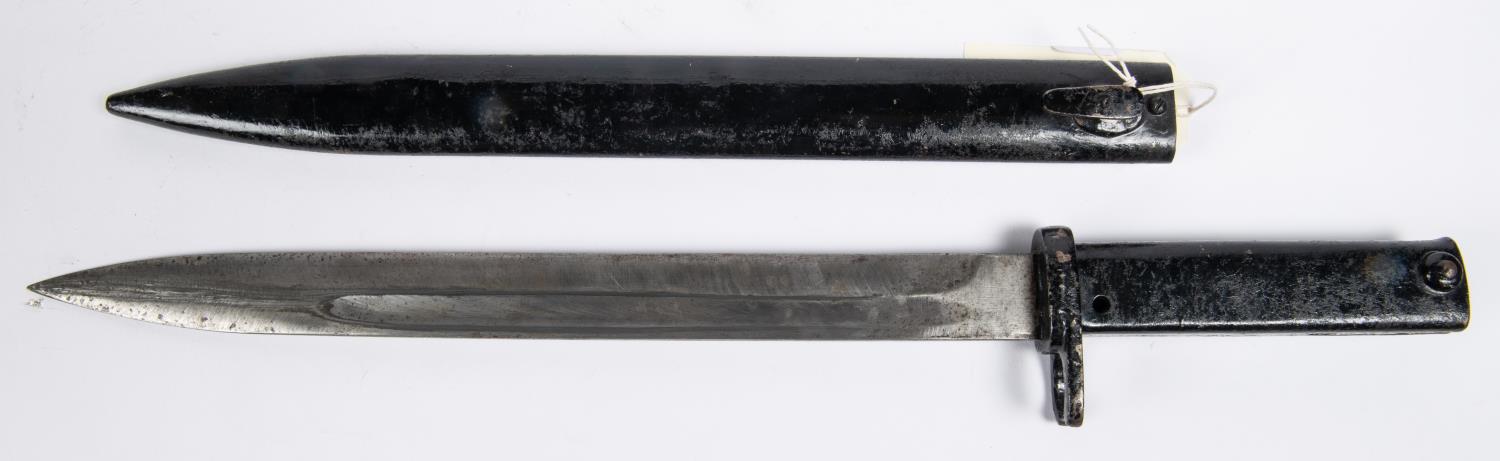 A WWI German "Ersatz" bayonet, fullered blade 12¼", plain all steel hilt with oil hole, in its steel