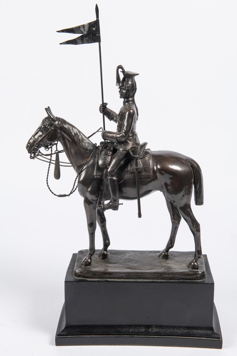 A bronzed composition equestrian figure of a mounted lancer, with lance cap, sword and lance, on - Image 2 of 3