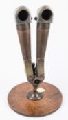 A German Third Reich period "donkey ear" prismatic periscope binocular, of heavy bronze, steel and