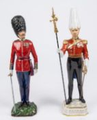 2 porcelain figurines: Gentleman at Arms, with partizan, 12¼"; and Scots Guards Captain with metal