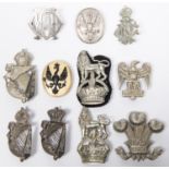 Seven cavalry white metal arm badges, another of black on gilt, and 3 other cast white metal. GC (