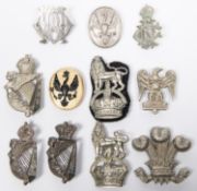 Seven cavalry white metal arm badges, another of black on gilt, and 3 other cast white metal. GC (