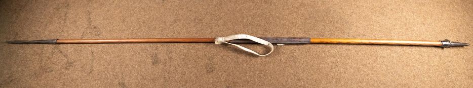 A wooden cavalry lance, 106" (8'10") overall, the shoe stamped "17.2RL" (faint), with leather