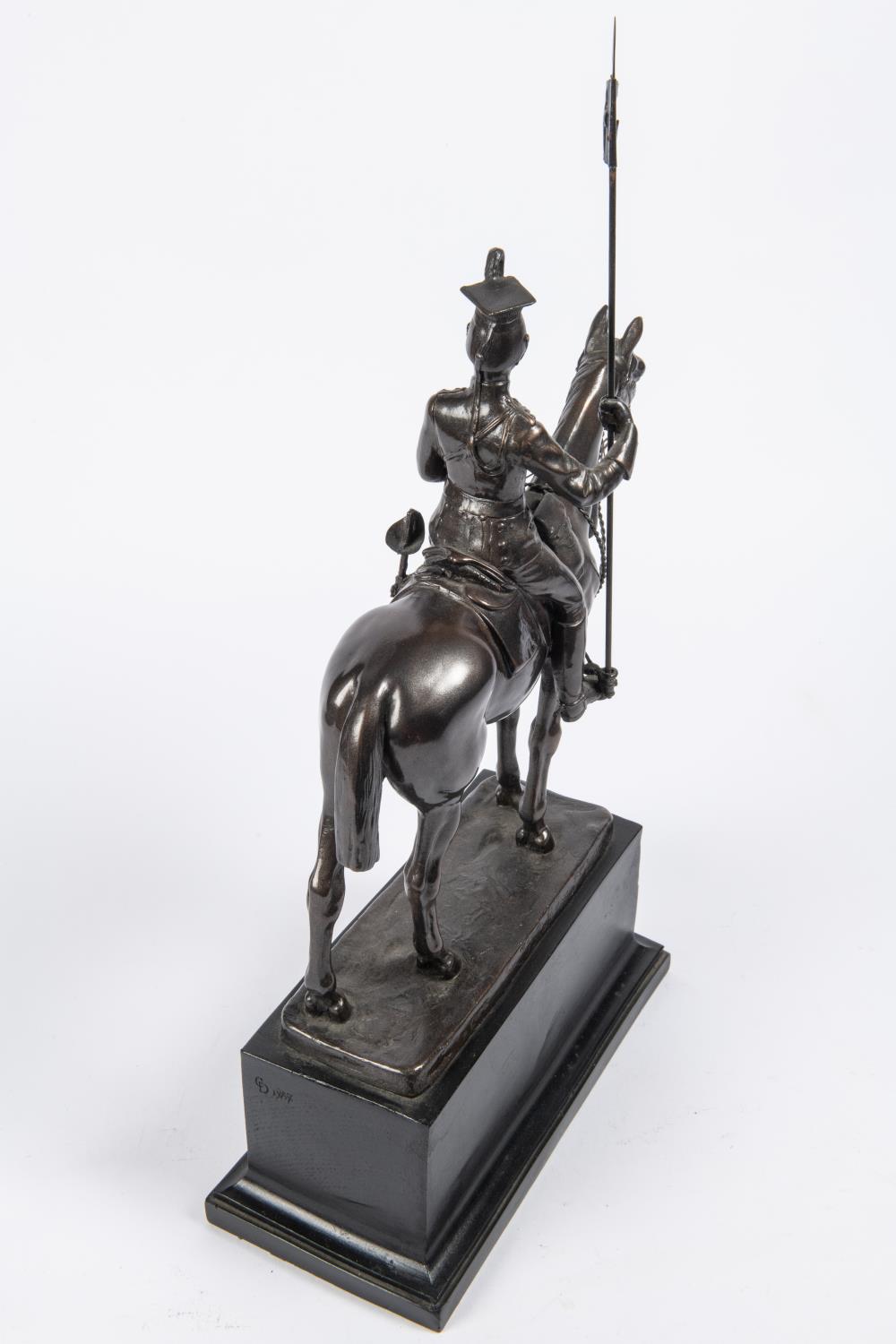 A bronzed composition equestrian figure of a mounted lancer, with lance cap, sword and lance, on - Image 3 of 3