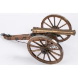 A well made model of a Waterloo period field gun, turned brass barrel 9½" (not bored through), on