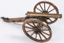 A well made model of a Waterloo period field gun, turned brass barrel 9½" (not bored through), on