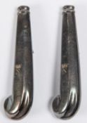A pair of silver coloured pistol grip dinner knife handles, reputed to have come from Nelson's
