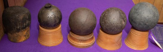 An explosive cannon ball or grenade, approximately 3¼" diameter, with fuze plug; also three large