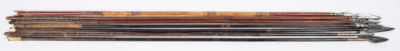 Seven 18th century Indian arrows, with varying flat leaf shaped heads, including two with central