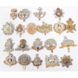 20 different Infantry cap badges, including pre 1923 Manchester, Suffolk, KRRC, Ryl Ulster Rifles,