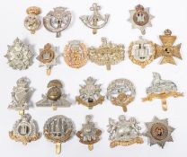 20 different Infantry cap badges, including pre 1923 Manchester, Suffolk, KRRC, Ryl Ulster Rifles,