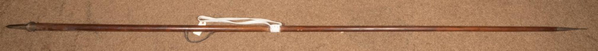 A 19th century wooden cavalry lance, 109" (9'1") overall, with small flattened diamond section head,