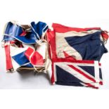 A printed Union flag, 46" x 78", another small Union flag (stitched); and a box of red, white and