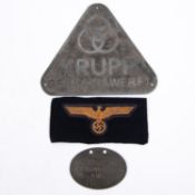 A Third Reich plaque, 6½" x 5½" triangular alloy with "Krupp Germaniawerft" and rings motif; also