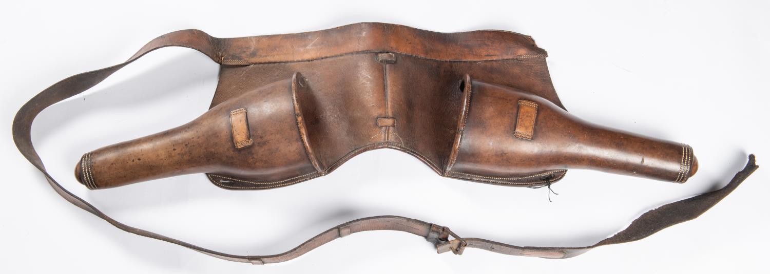 A good pair of mid 19th century cavalry leather saddle holsters, with girth strap. GC (some cracking - Image 2 of 3