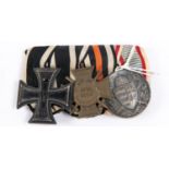 A WWI German medal trio: 1914 Iron Cross 2nd class, 1914-1918 Honour Cross with swords, and