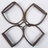 A pair of interesting old (18th-19th century) iron stirrups, of which one arm and the foot plate can