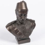 A bronzed composition bust of General Gordon, in Egyptian court dress with fez, height including