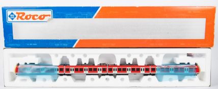 A Roco 'HO' gauge DB 4-car articulated Electric Multiple Unit (63050). In red & grey livery, with