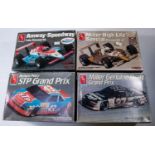 4x unmade American 1:25 AMT Plastic Race Car Kits. A Richard Petty STP Grand Prix Pontiac (#6728). A