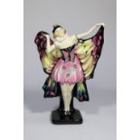 A Royal Doulton 'Butterfly' figurine (HN719) in pink, black and yellow. Designed by L. Harradine.