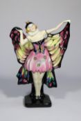 A Royal Doulton 'Butterfly' figurine (HN719) in pink, black and yellow. Designed by L. Harradine.