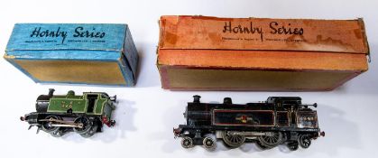 2x Hornby O gauge clockwork locomotives. A BR No.2 Special 4-4-2T loco, 6948, in lined black. An